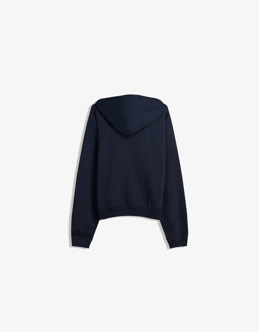 SWEAT ZIPPÉ OVERSIZE À CAPUCHE