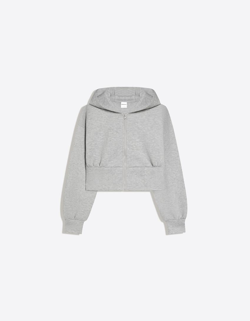 SWEAT ZIPPÉ À CAPUCHE TAILLE HAUTE