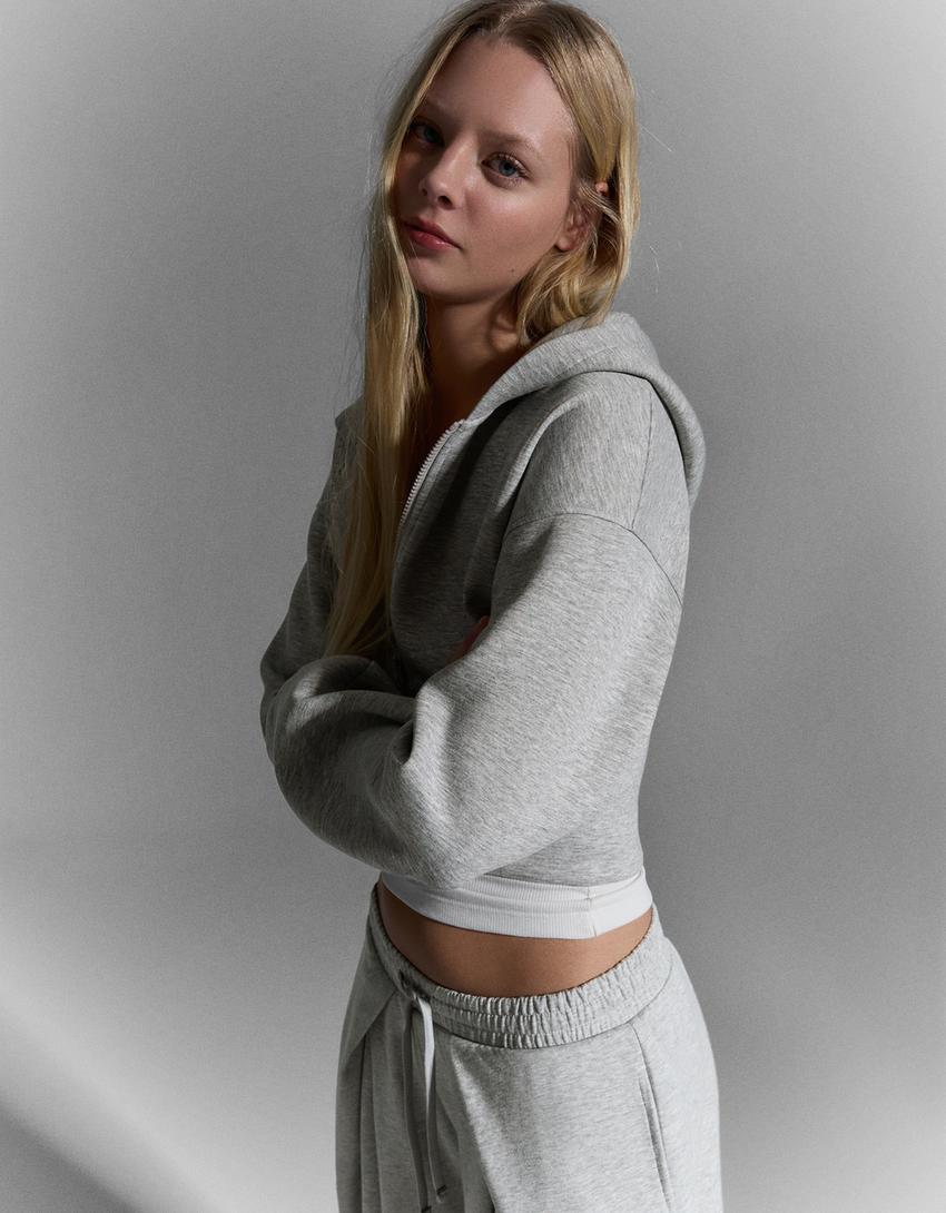 SWEAT ZIPPÉ À CAPUCHE TAILLE HAUTE
