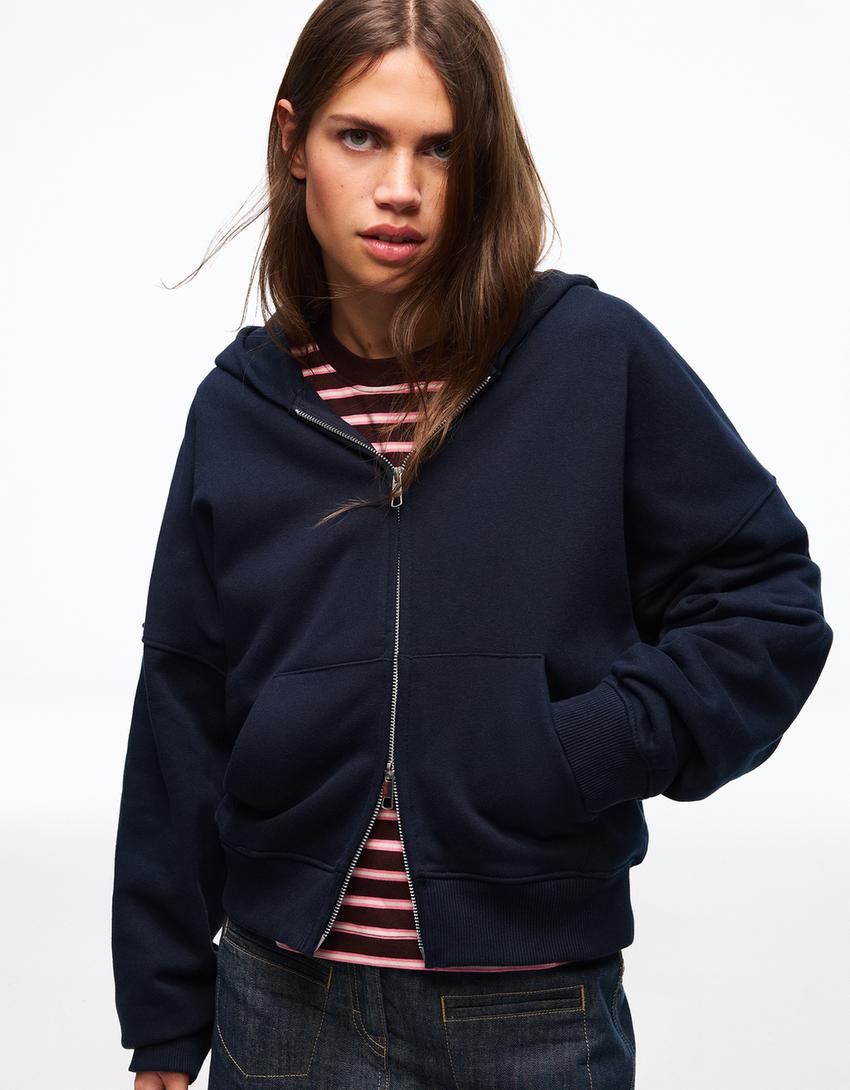SWEAT ZIPPÉ OVERSIZE À CAPUCHE