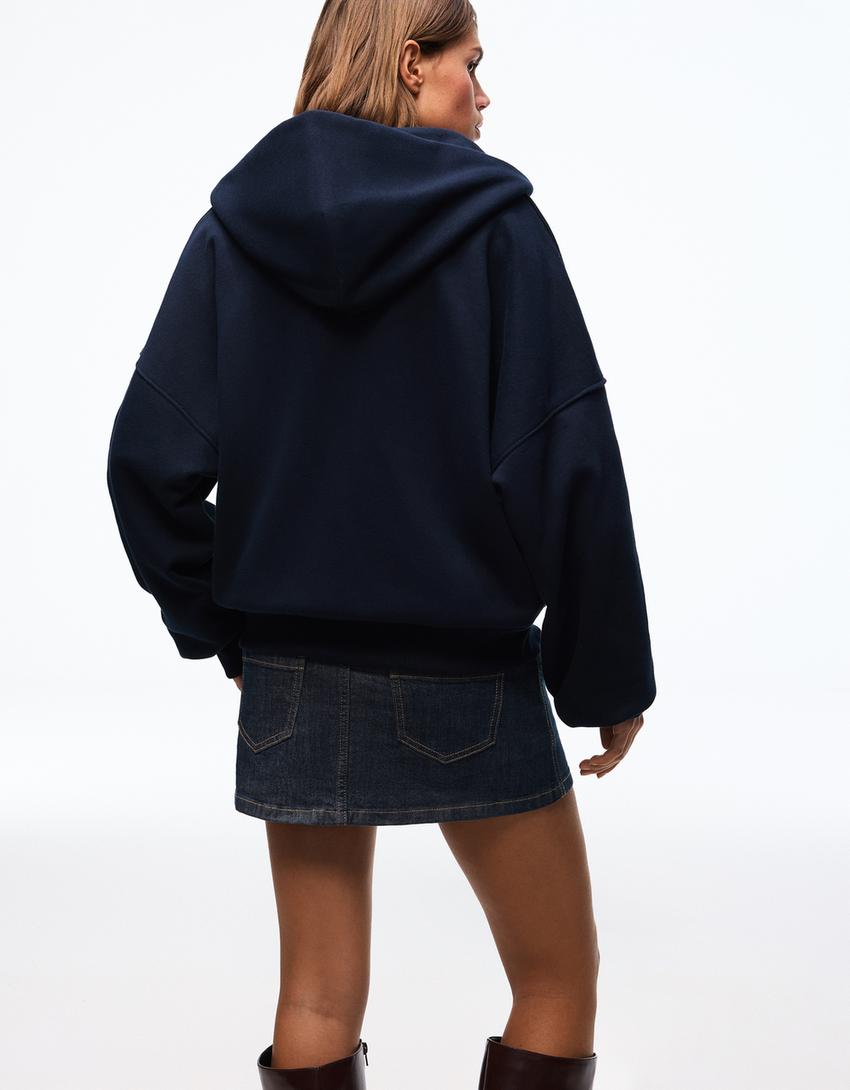 SWEAT ZIPPÉ OVERSIZE À CAPUCHE