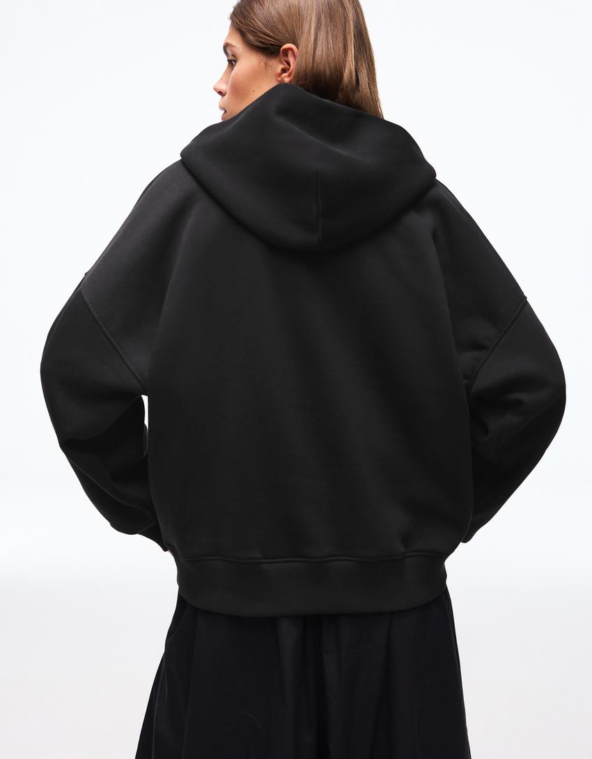 SWEAT ZIPPÉ OVERSIZE À CAPUCHE