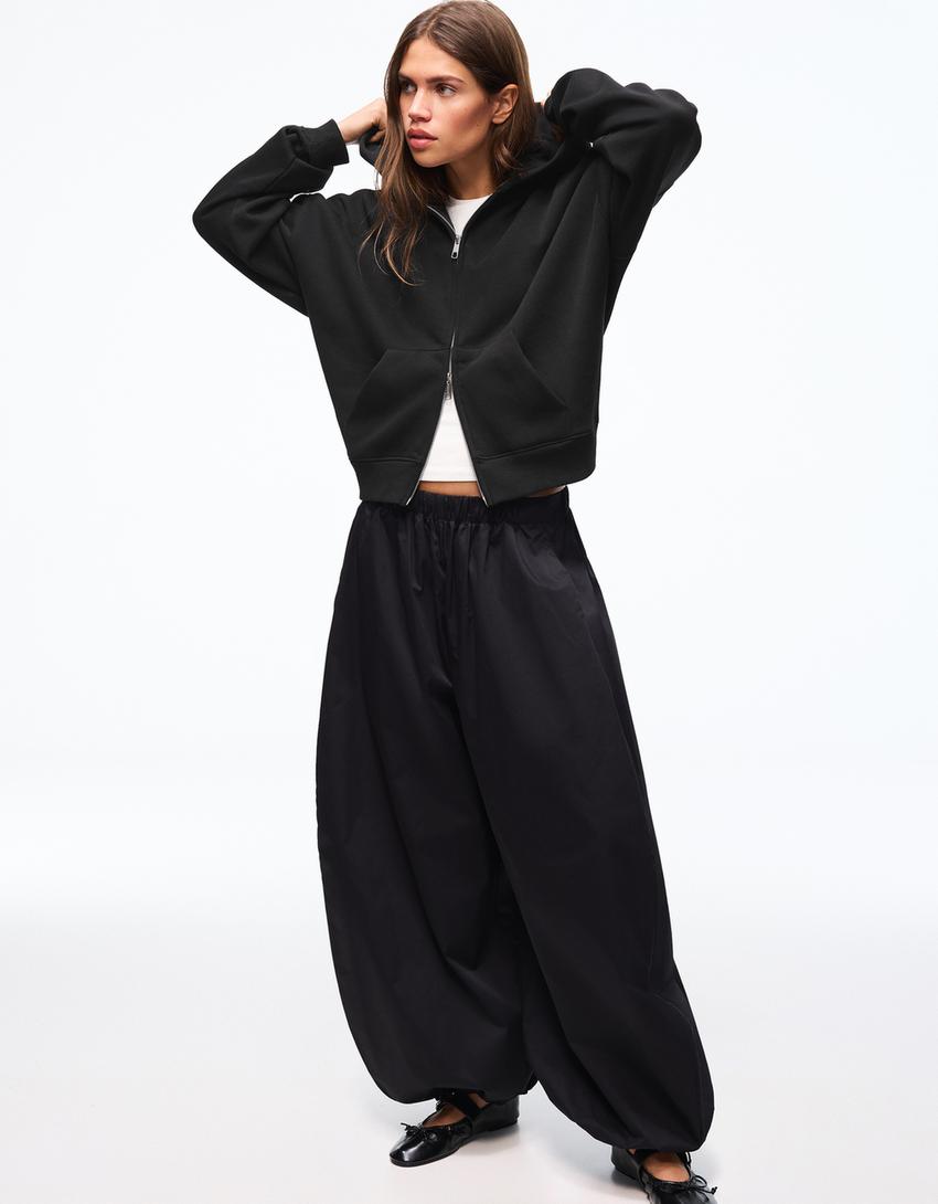 SWEAT ZIPPÉ OVERSIZE À CAPUCHE