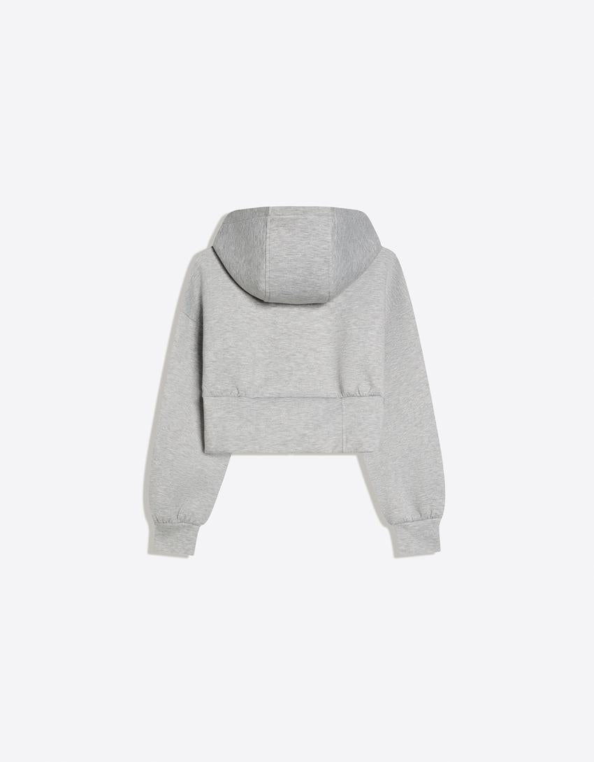 SWEAT ZIPPÉ À CAPUCHE TAILLE HAUTE
