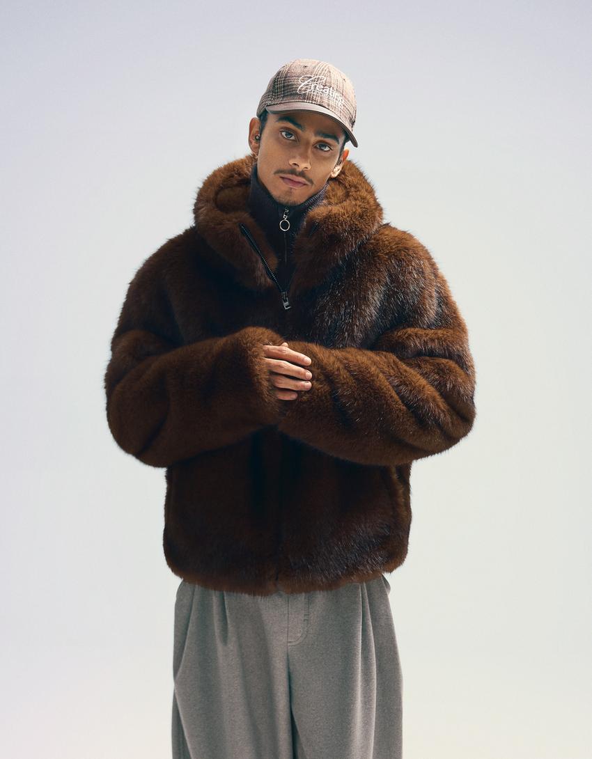 Blouson fausse fourrure à capuche