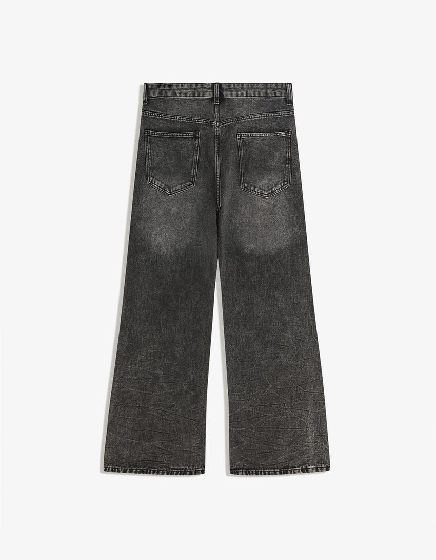 PANTALON FLARE À CLOUS