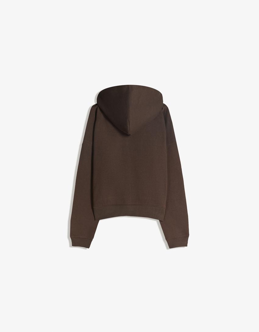 SWEAT ZIPPÉ OVERSIZE À CAPUCHE