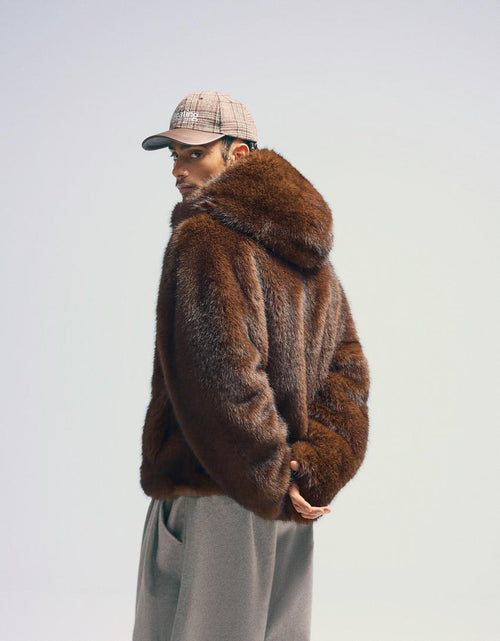 Blouson fausse fourrure à capuche