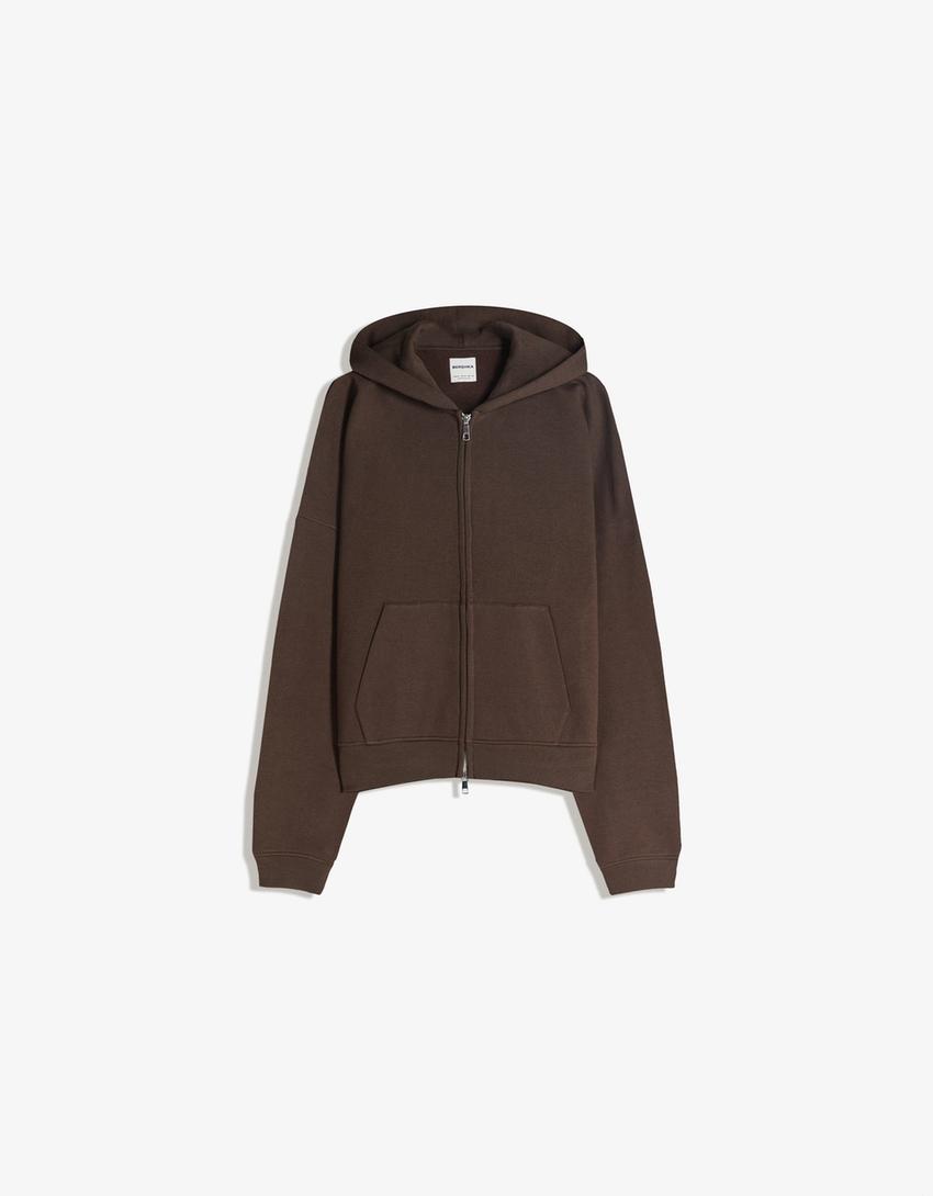 SWEAT ZIPPÉ OVERSIZE À CAPUCHE