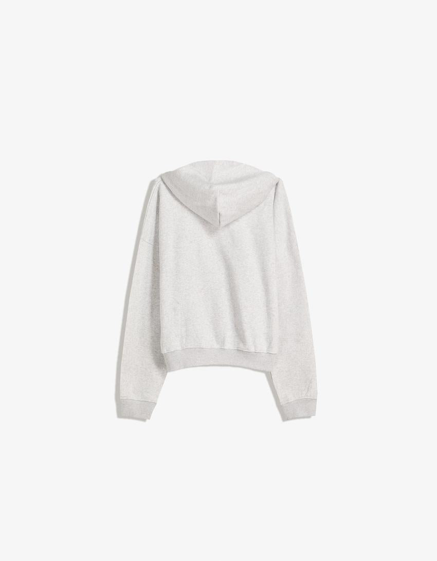 SWEAT ZIPPÉ OVERSIZE À CAPUCHE