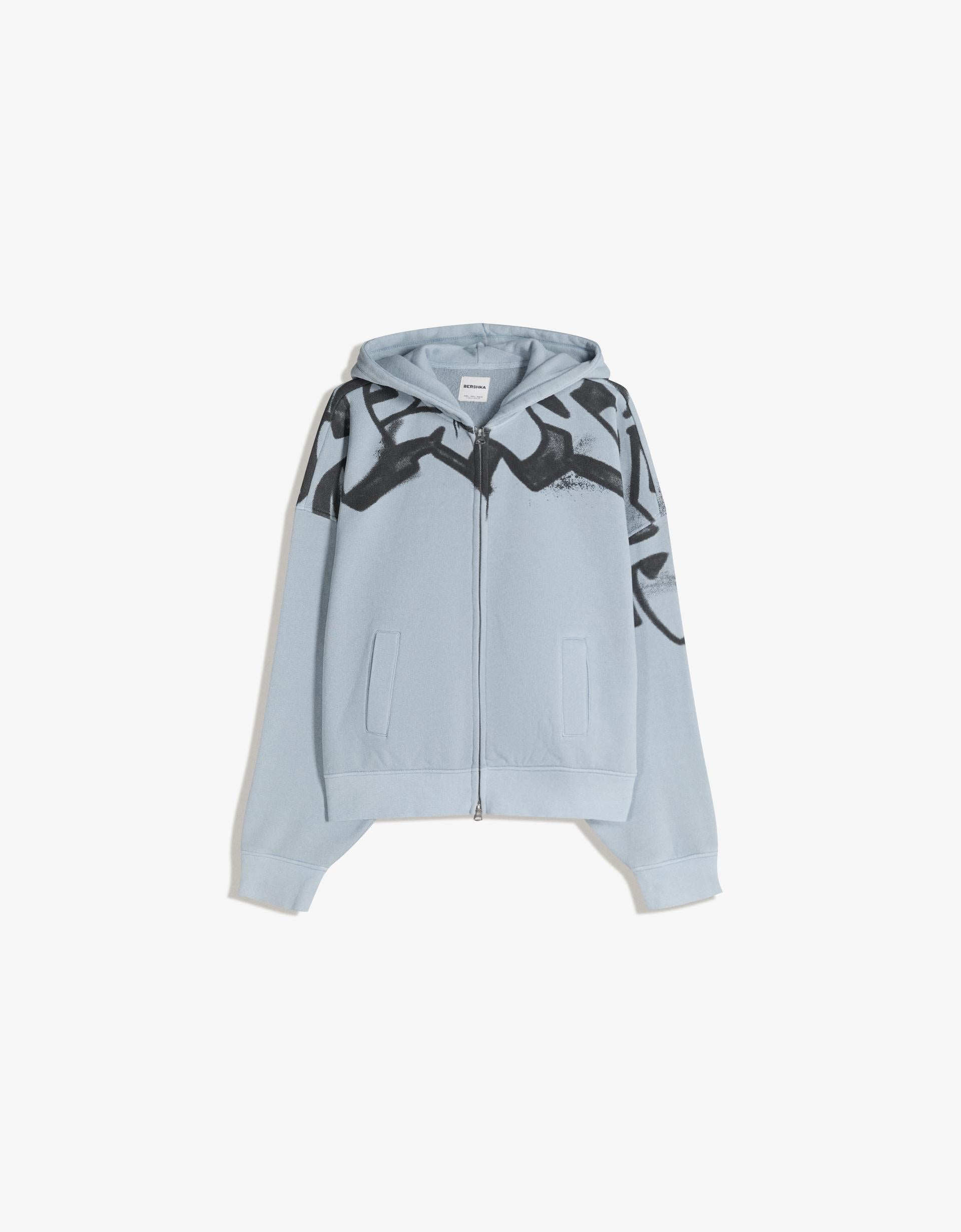 SWEAT ZIPPÉ À CAPUCHE IMPRIMÉ