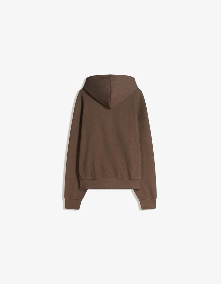SWEAT ZIPPÉ GAUFRÉ
